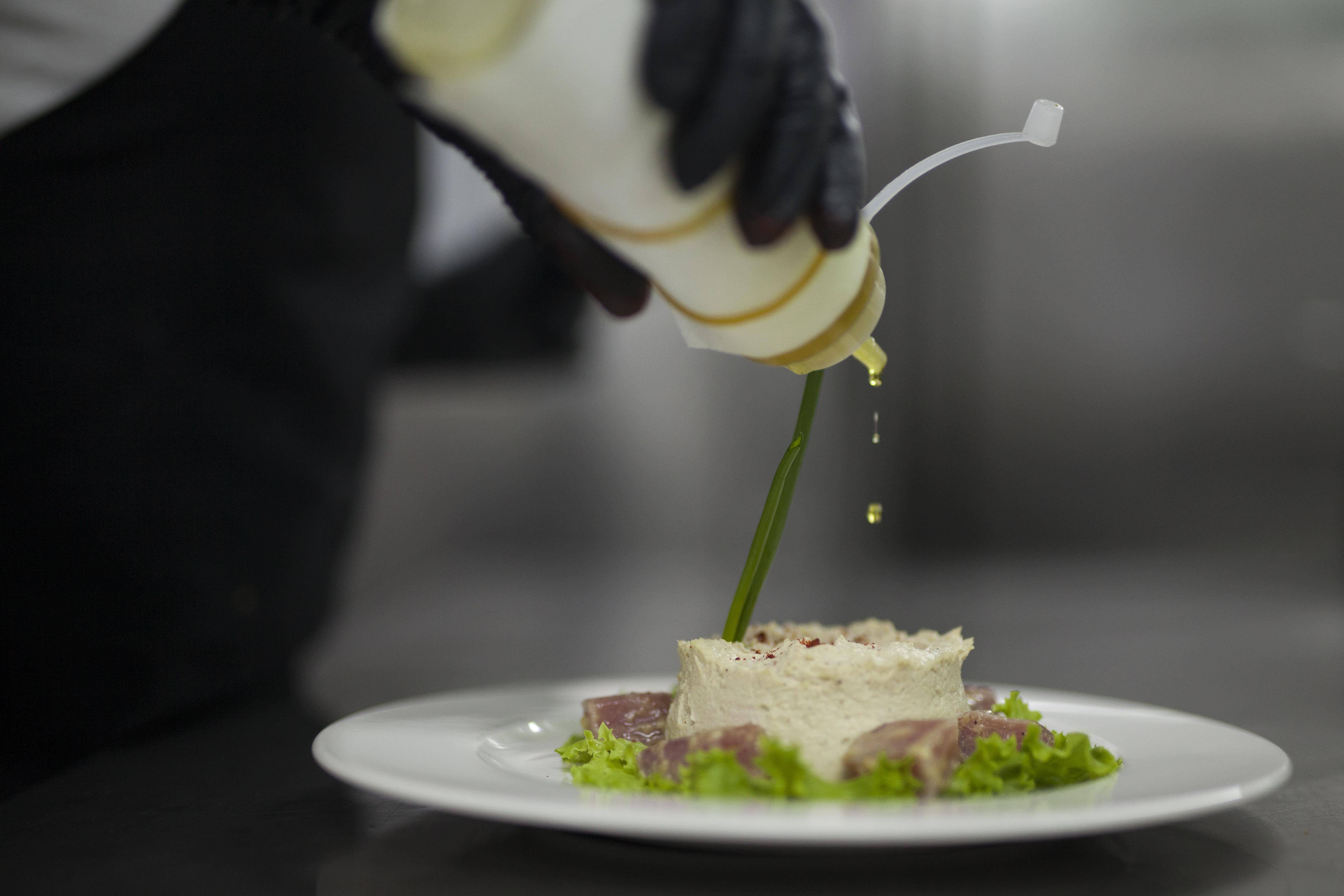 Grand Hotel Yerevan - Small Luxury Hotels Of The World Екстер'єр фото A chef finishing a dish